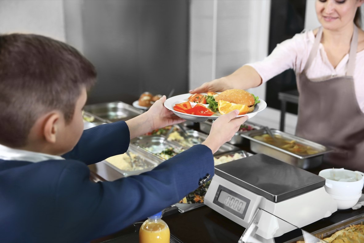 school lunch line with student